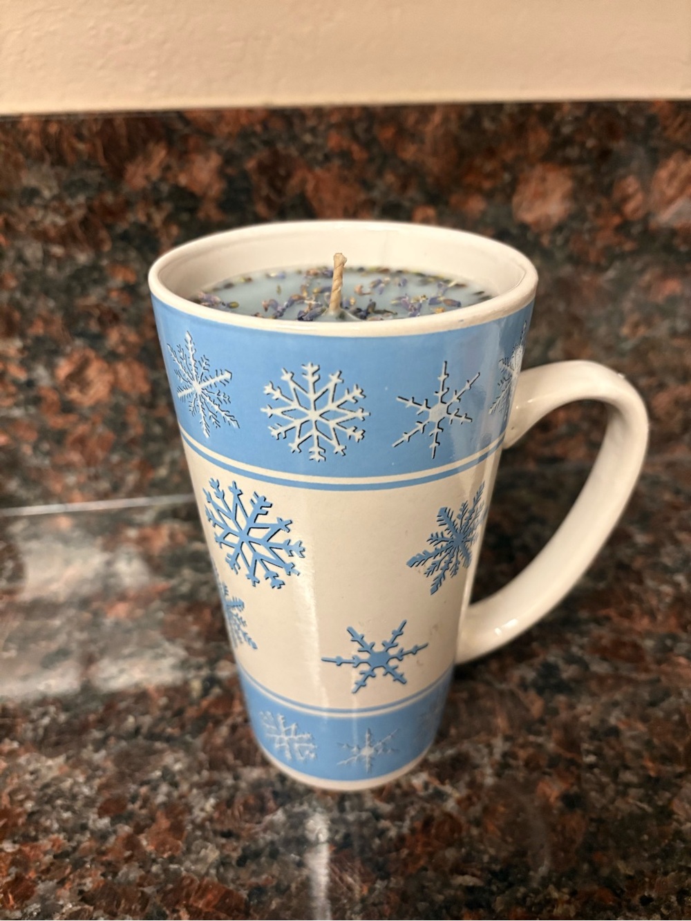 Upcycled frosted sugar cookie candle in a snowflake mug with lavender on top
